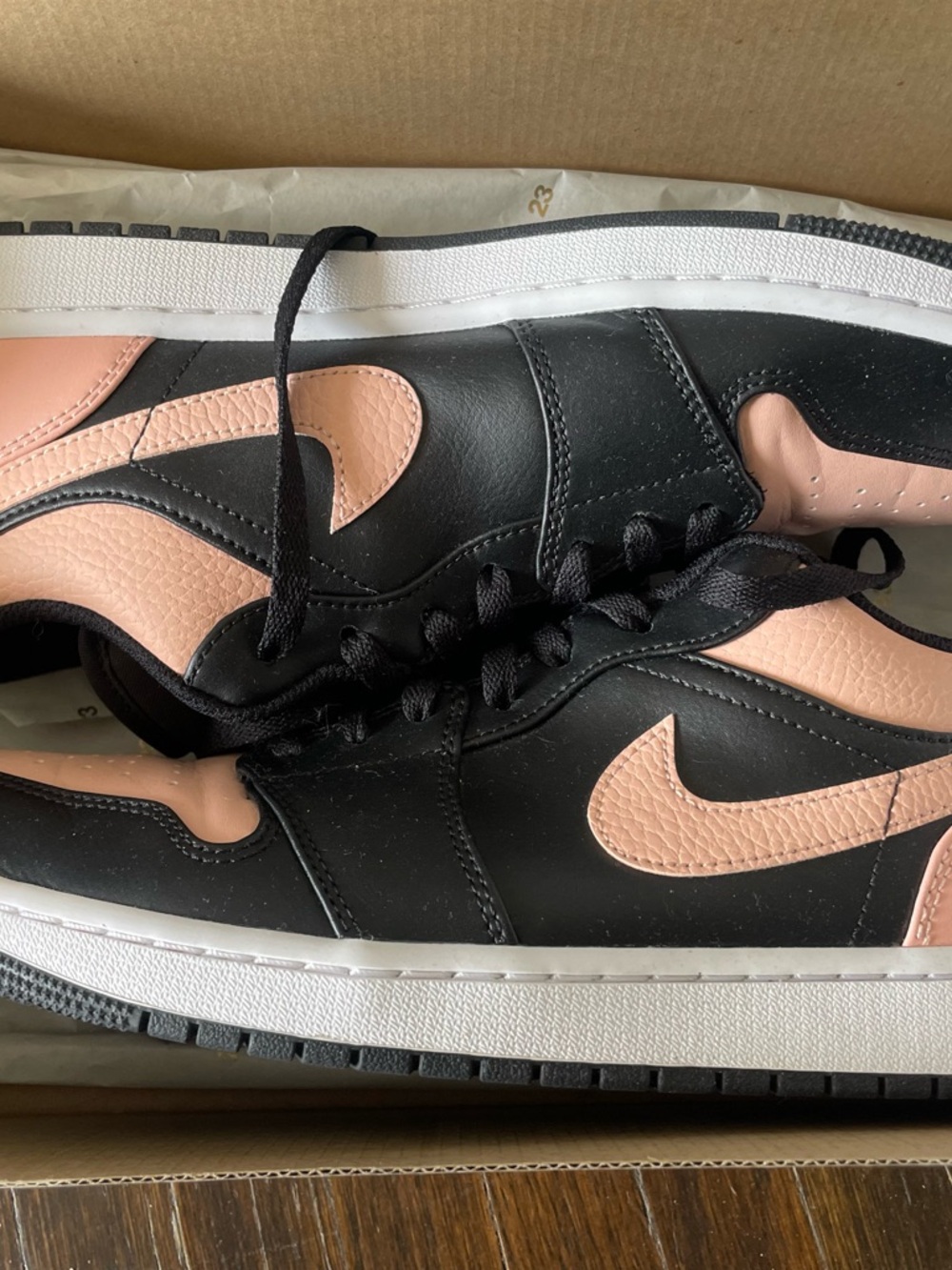 Nike Air Jordan 1 Low in the "Crimson Tint" colorway
